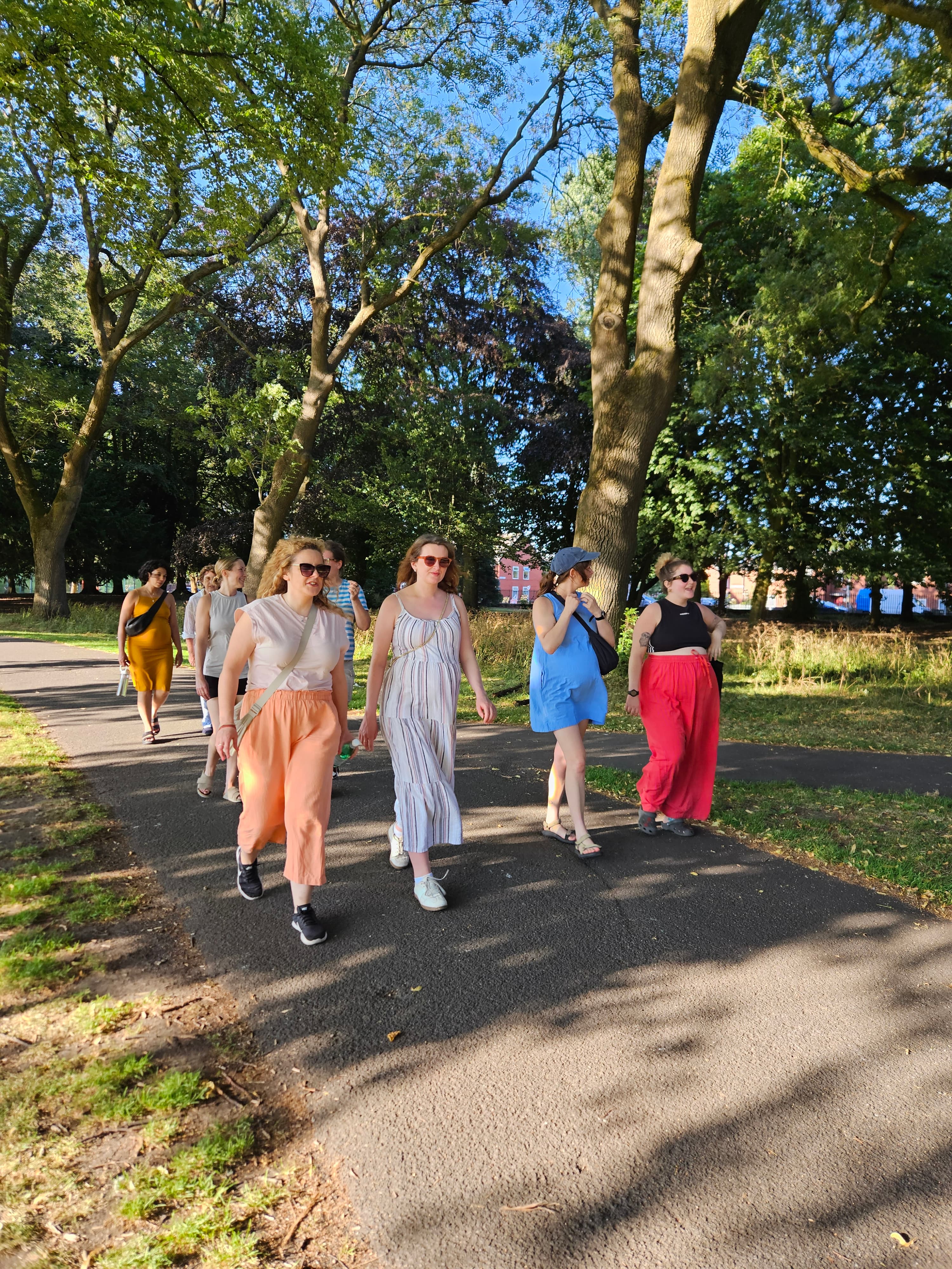 Group of pregnant women walking together in the park at Bumps in the Park